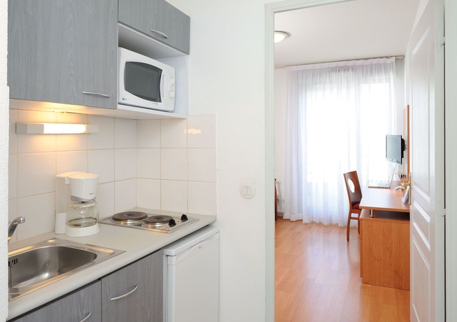 Imagen de la habitación del Apartahotel Séjours and Affaires Lyon Park Lane. Foto 11