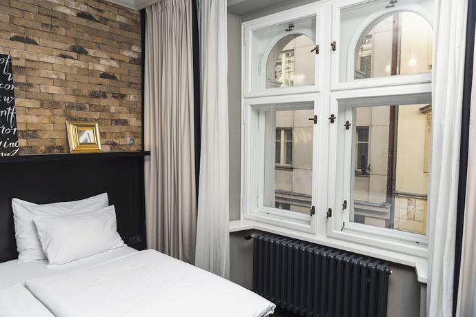 Imagen de la habitación del Apartahotel numa l Root Rooms & Apartments. Foto 5