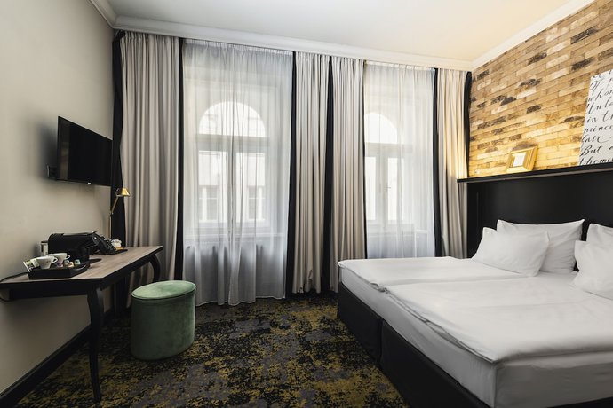 Imagen de la habitación del Apartahotel numa l Root Rooms & Apartments. Foto 7