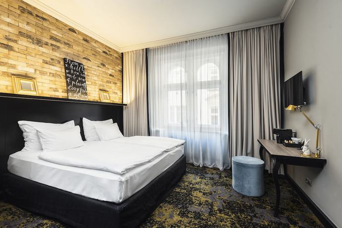 Imagen de la habitación del Apartahotel numa l Root Rooms & Apartments. Foto 9