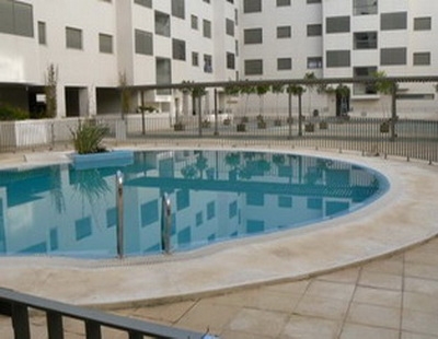 Imagen de la piscina del Apartamentos APARTAMENTOS EL PUERTO. Foto 3