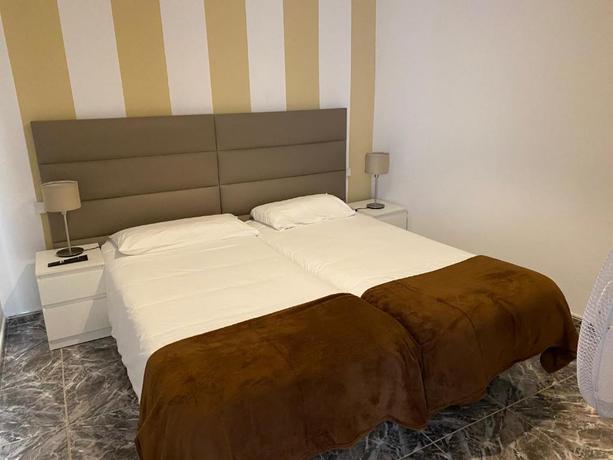 Imagen de la habitación del Apartamentos Apartamentos La Aldea Suites. Foto 9