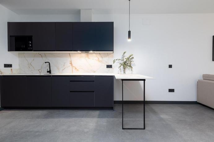 Imagen de la habitación del Apartamentos Calatrava by Alma Suites. Foto 11