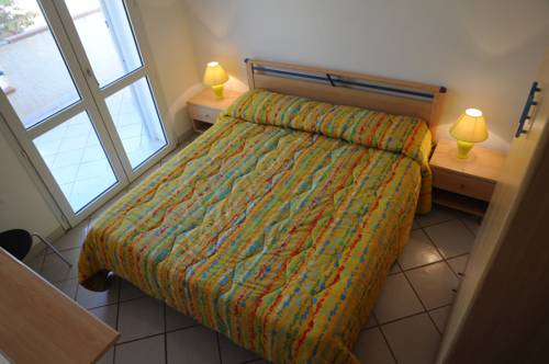 Imagen de la habitación del Apartamentos Case Vacanze Lumia. Foto 6