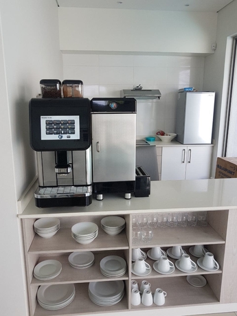 Imagen del bar/restaurante del Apartamentos Daisy Place. Foto 3