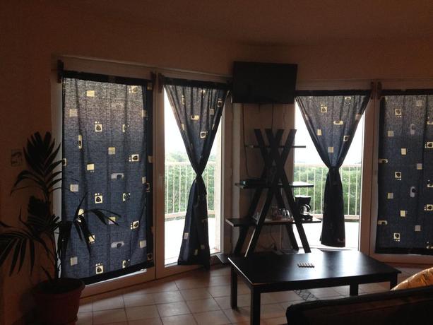 Imagen de la habitación del Apartamentos El Faro Apartment. Foto 4