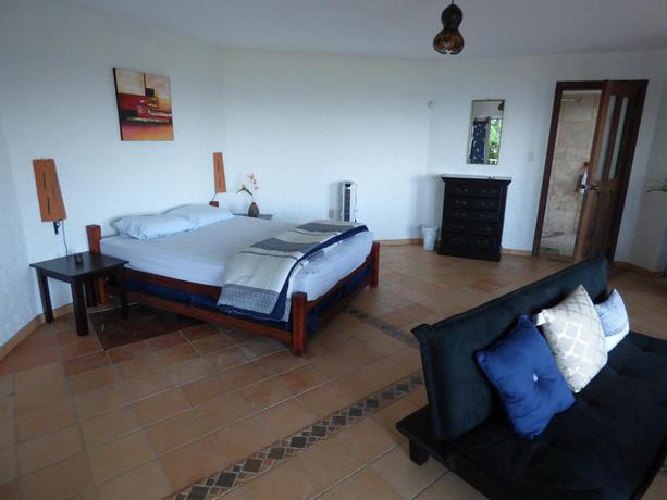 Imagen de la habitación del Apartamentos El Faro Apartment. Foto 7