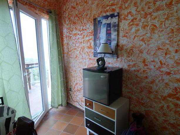 Imagen de la habitación del Apartamentos El Faro Apartment. Foto 11
