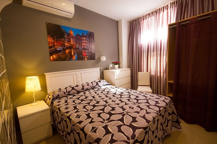 Imagen de la habitación del Apartamentos El Templo Suites. Foto 4