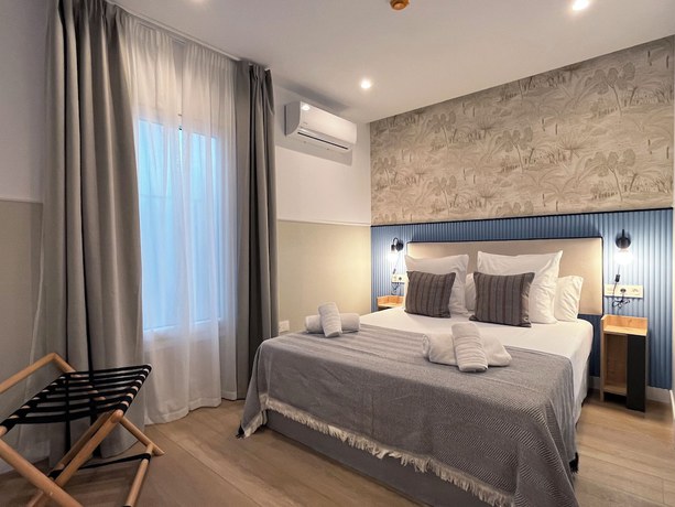Imagen de la habitación del Apartamentos Feelathome Palacio de &Aacute;lamos. Foto 17