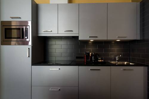 Imagen de la habitación del Apartamentos Golden Mansion Aparthotel. Foto 17