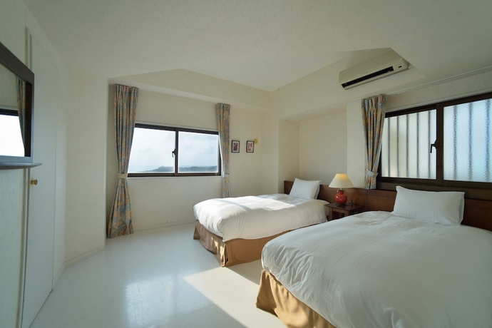 Imagen de la habitación del Apartamentos Hotel Royal Marine Palace Ishigakijima. Foto 11