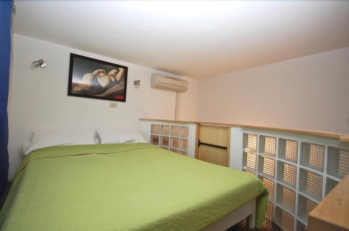 Imagen de la habitación del Apartamentos House and The City - Trastevere. Foto 3