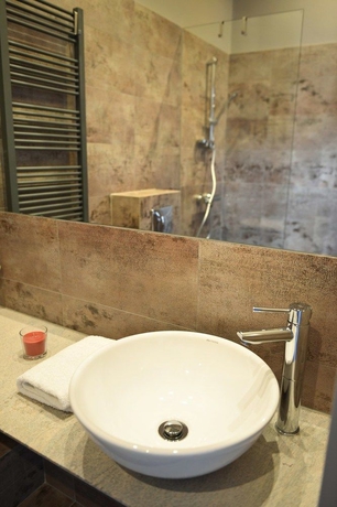 Imagen de la habitación del Apartamentos La Gioia Grey Stylish Apartments. Foto 13