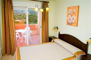 Imagen de la habitación del Apartamentos MONTEMAR NATURA RESORT. Foto 2