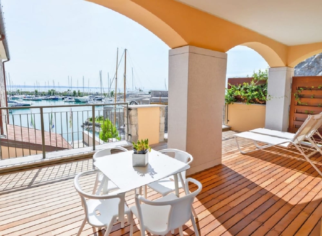 Imagen de la habitación del Apartamentos Portopiccolo Apartments. Foto 8
