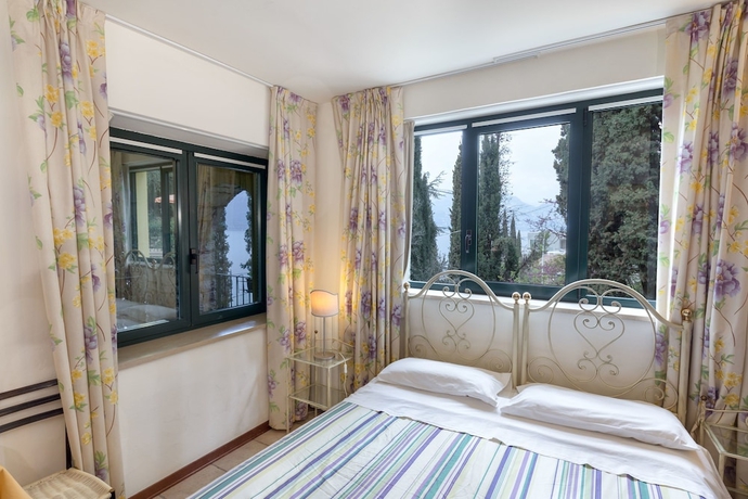 Imagen de la habitación del Apartamentos Residence Gardasee Apartments With Lake View. Foto 15