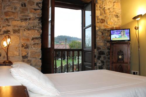 Imagen de la habitación del Apartamentos Rodiles Rural. Foto 10