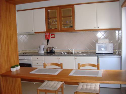 Imagen de la habitación del Apartamentos Rossio Mar. Foto 8