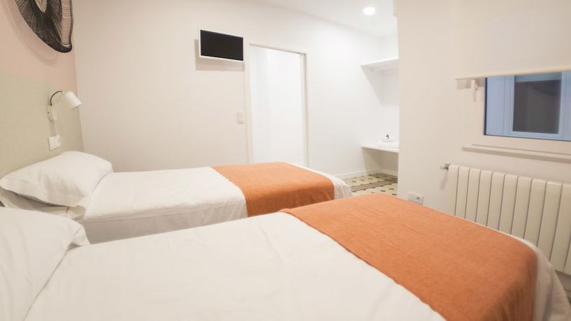 Imagen de la habitación del Apartamentos Santiago Center Rooms. Foto 7