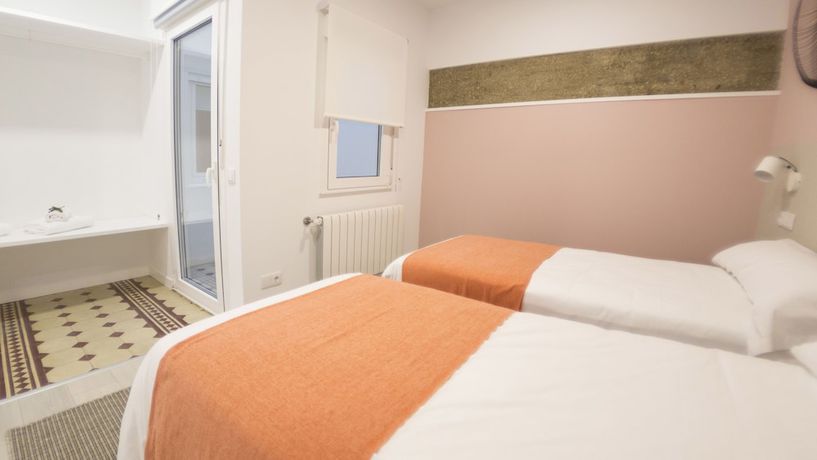 Imagen de la habitación del Apartamentos Santiago Center Rooms. Foto 20