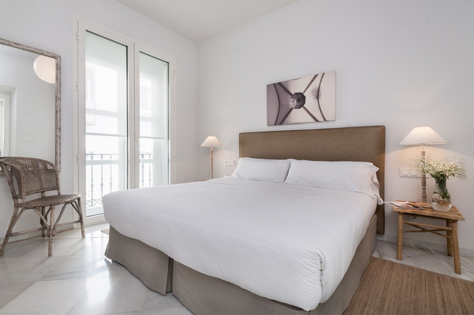 Imagen de la habitación del Apartamentos Suites Sevilla Plaza. Foto 11