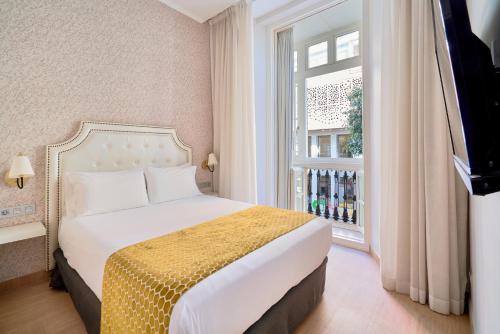 Imagen de la habitación del Apartamentos Tandem Soho Suites. Foto 4