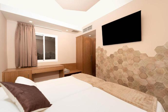 Imagen de la habitación del Apartamentos The Hive Boutique - Adults Only. Foto 10