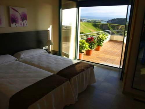 Imagen de la habitación del Apartamentos Turísticos Playa de Tapia. Foto 12