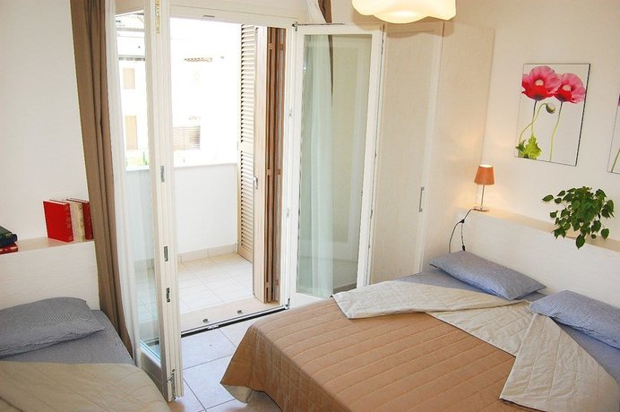 Imagen de la habitación del Apartamentos Villaggio Evanike. Foto 16