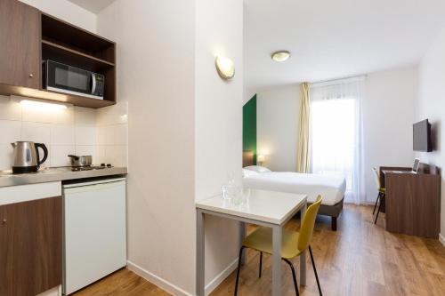 Imagen de la habitación del Aparthotel Adagio Access Carri&egrave;res-sous-poissy. Foto 14