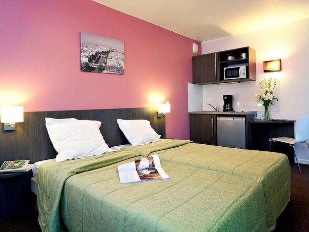 Imagen de la habitación del Aparthotel Adagio Access Paris Asni&egrave;res Aparthotel. Foto 11