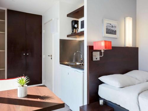 Imagen de la habitación del Aparthotel Adagio Access Paris Bastille. Foto 19