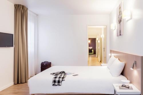 Imagen de la habitación del Aparthotel Adagio Access Paris Clichy. Foto 20