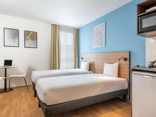 Imagen de la habitación del Aparthotel Adagio Access Paris Quai D'ivry. Foto 18