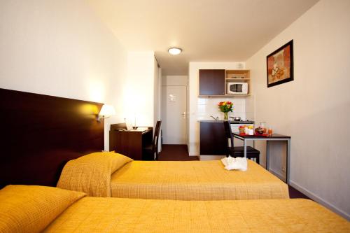 Imagen de la habitación del Aparthotel Adagio Access Paris Saint Denis Pleyel. Foto 15