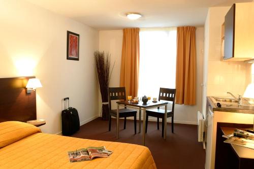Imagen de la habitación del Aparthotel Adagio Access Paris Saint Denis Pleyel. Foto 16