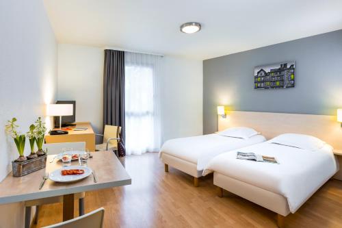 Imagen de la habitación del Aparthotel Adagio Access Rennes Centre. Foto 12