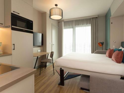 Imagen de la habitación del Aparthotel Adagio Antwerp City Center. Foto 18