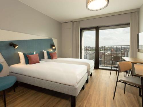 Imagen de la habitación del Aparthotel Adagio Antwerp City Center. Foto 19