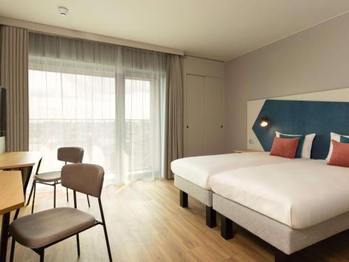 Imagen de la habitación del Aparthotel Adagio Antwerp City Center. Foto 20