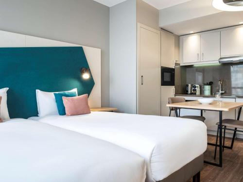 Imagen de la habitación del Aparthotel Adagio Paris Nation. Foto 13