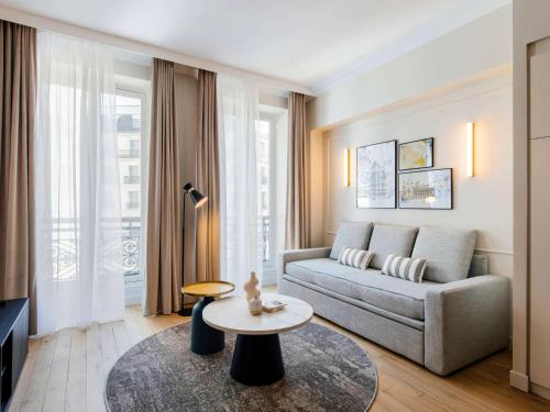 Imagen de la habitación del Aparthotel Adagio Paris Opera. Foto 14