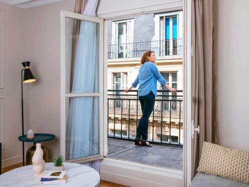Imagen de la habitación del Aparthotel Adagio Paris Opera. Foto 16