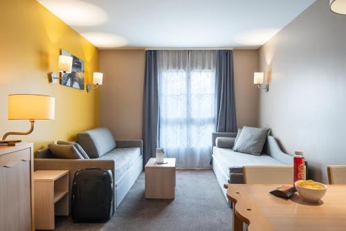 Imagen de la habitación del Aparthotel Adagio Val d'Europe pr&egrave;s de Disneyland Paris. Foto 17