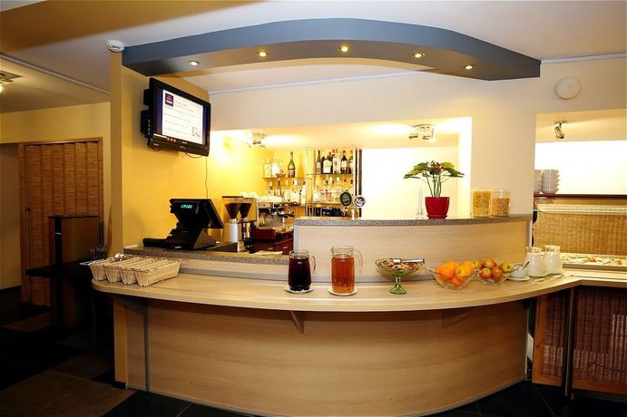 Imagen del bar/restaurante del Aparthotel Apart Hotel Tomo. Foto 3