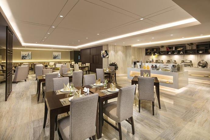 Imagen del bar/restaurante del Aparthotel Ascott Teda Msd Tianjin. Foto 2