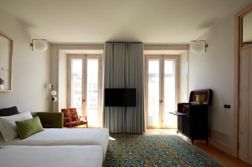 Imagen de la habitación del Aparthotel Cais Urban Lodge. Foto 11