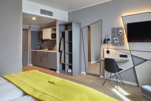 Imagen de la habitación del Aparthotel Candlewood Suites Dusseldorf Airport by IHG. Foto 20