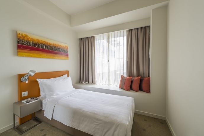 Imagen de la habitación del Aparthotel Citadines Mount Sophia Singapore. Foto 5